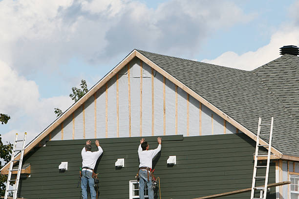 Professional Siding technician working in Polk City, FL